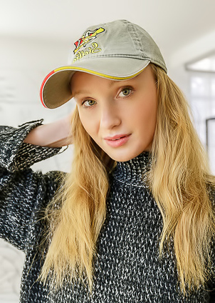 Dana Red With Strawberry-blonde Hair Lounging Naked In An Armchair