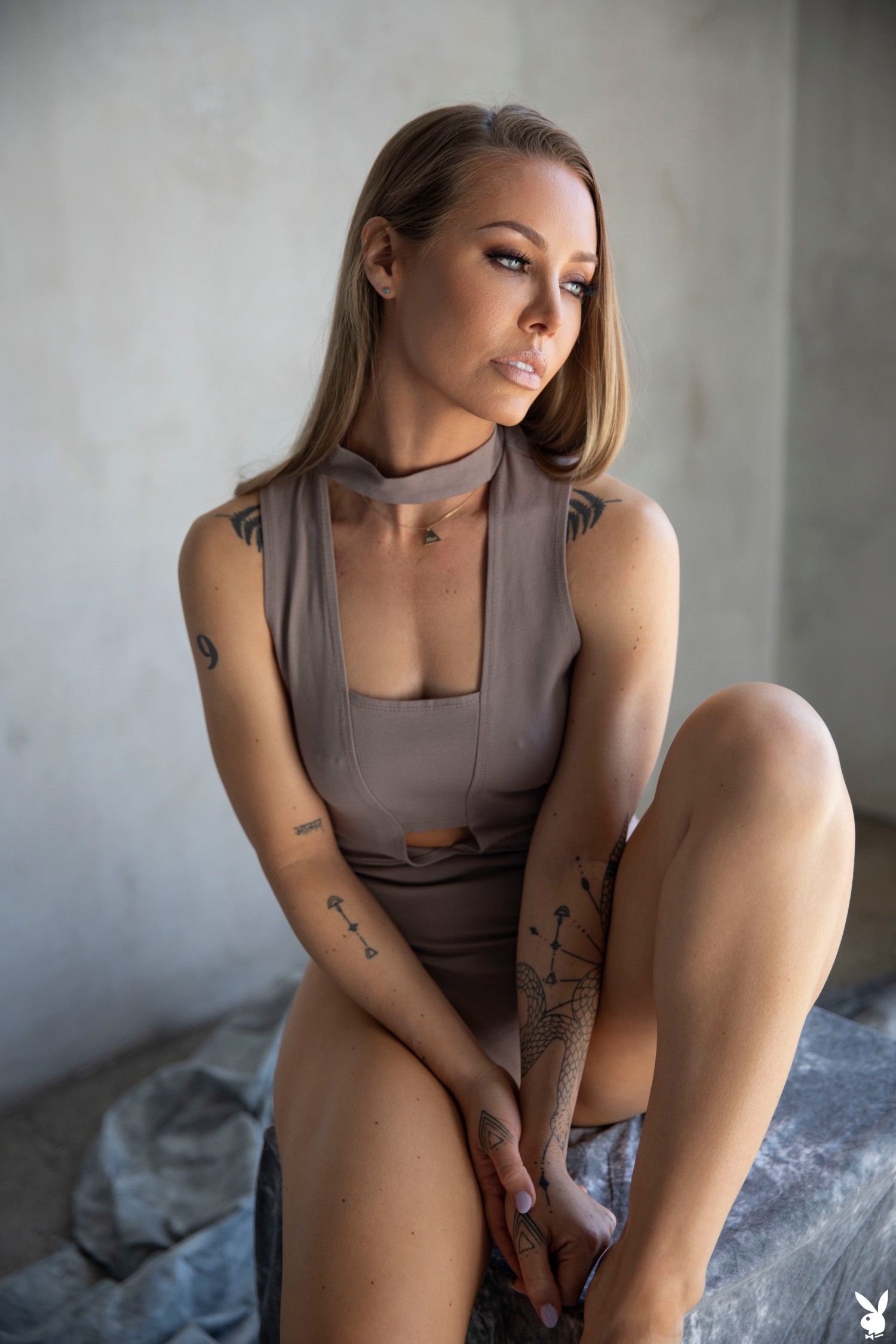 Nicole Aniston Poses In Lingerie Showcasing Tattoos And Confidence In Museum-style Photo Shoot