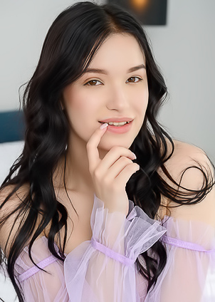 Wikki K Entices As She Spreads Her Long Legs Invitingly On The Bed