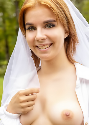 Lizbete Teases With Shaved Pussy On A Bench Outdoors