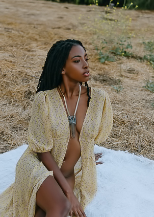 Sarissle in yellow dress, hills at sunset, holding bowl, eating slow with eyes closed, solo allure