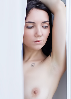 Danniela Flaunts Her Inked Skin As She Struts Against Bedroom Wall