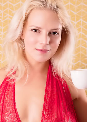Evas Lace Bodysuit Takes Command on Chair