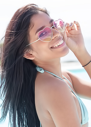 Karin Torres Basks in the Ray of Sunlight, Poised Elegantly in her Bikini